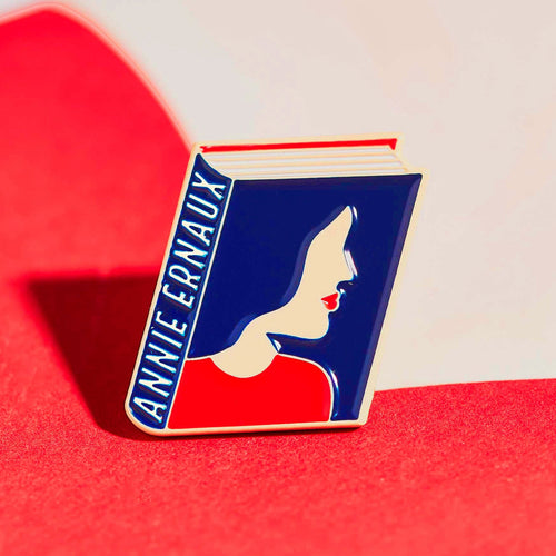 Annie Ernaux enamel book pin for independent bookstores, illustration by Judy Kaufmann
