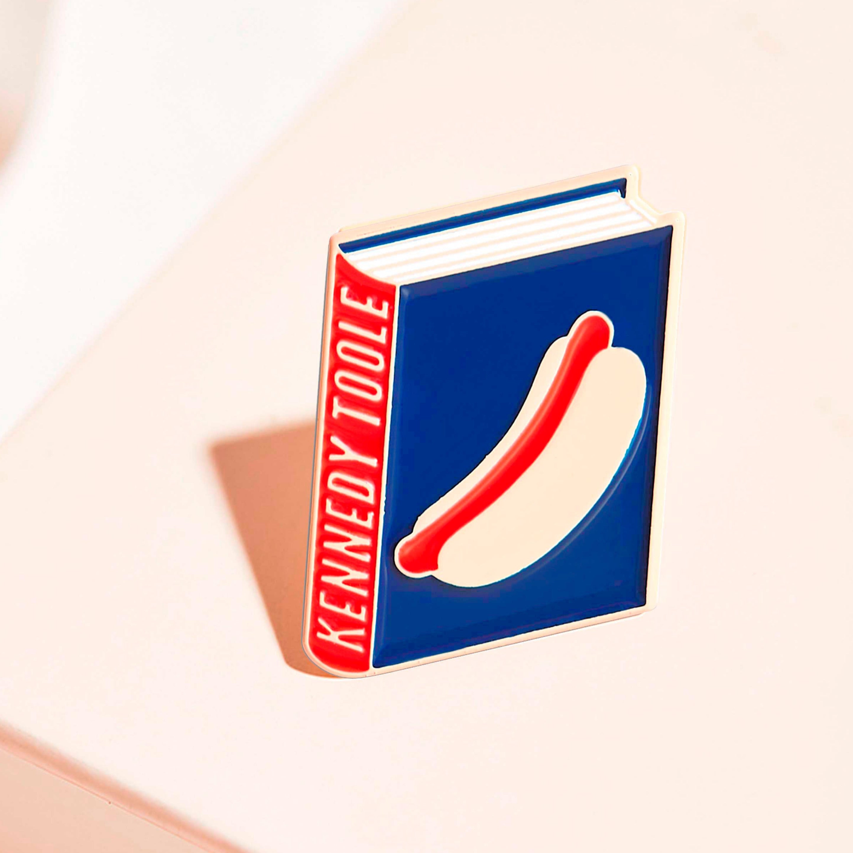 John Kennedy Toole enamel book pin for independent bookstores, illustration by Judy Kaufmann