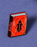 Kafka enamel book pin for independent bookstores and concept shops, illustration by Judy Kaufmann