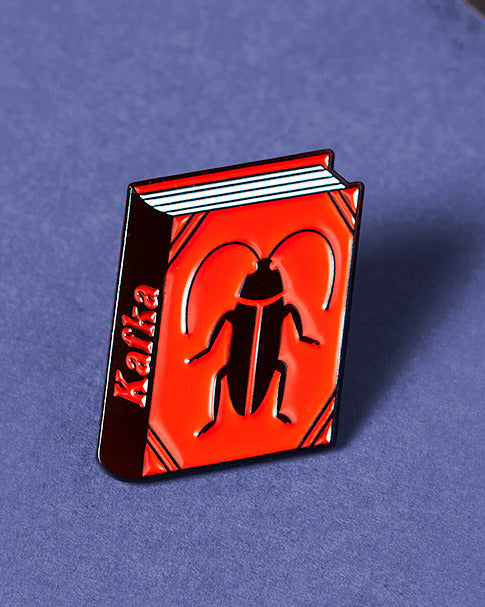 Kafka enamel book pin for independent bookstores and concept shops, illustration by Judy Kaufmann