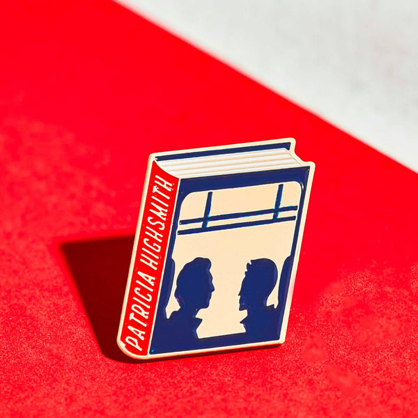Patricia Highsmith enamel book pin for independent bookstores, illustration by Judy Kaufmann