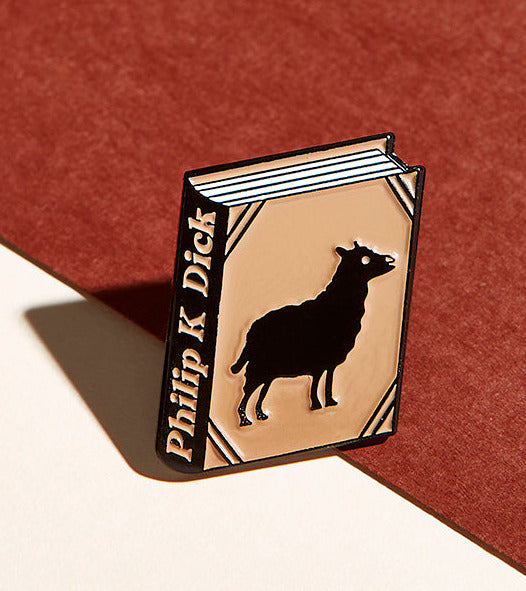 Philip K. Dick enamel book pin for independent bookstores and concept shops, illustration by Judy Kaufmann