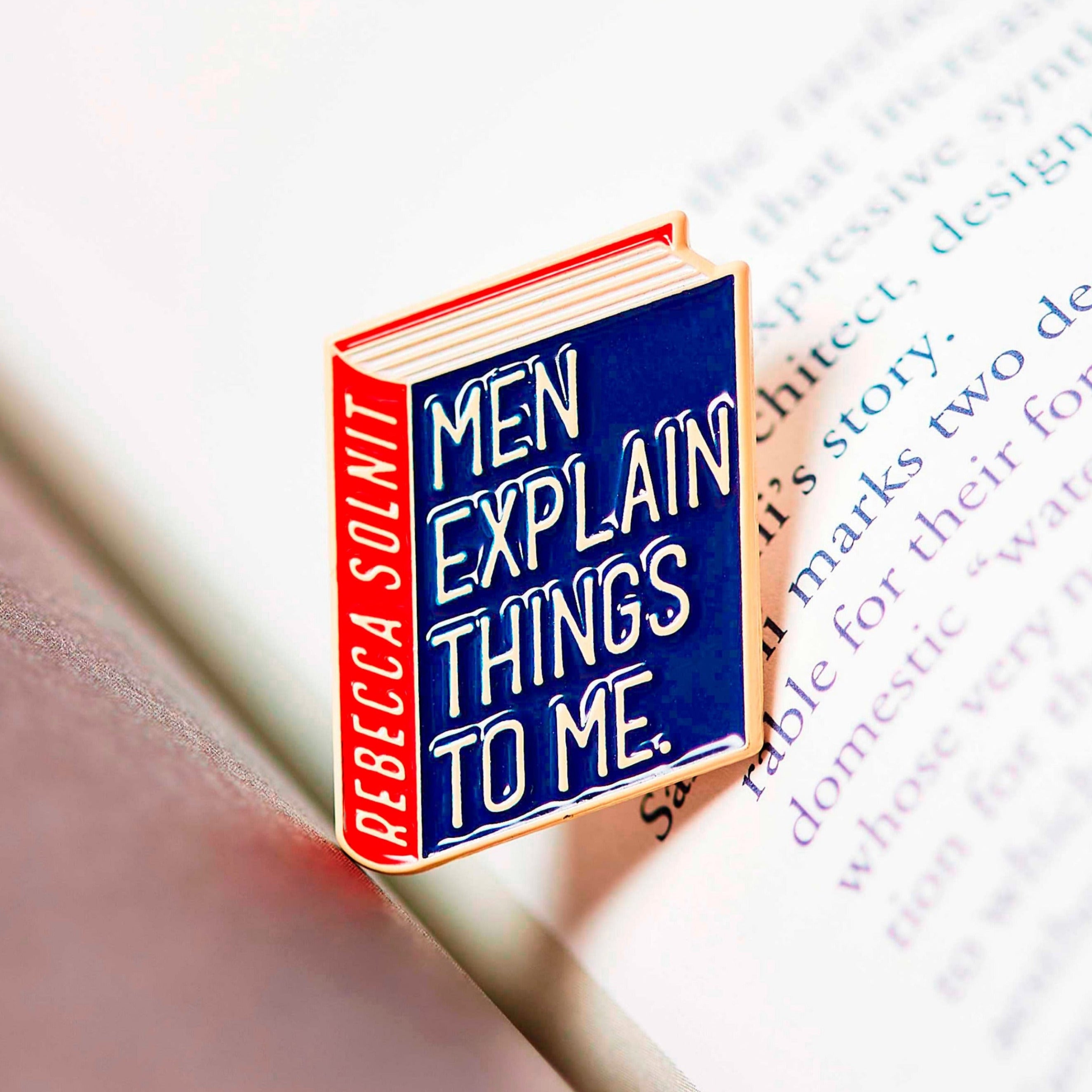 Rebecca Solnit enamel book pin for independent bookstores, illustration by Judy Kaufmann