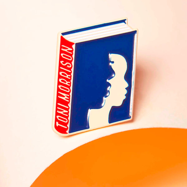 Toni Morrison enamel book pin for independent bookstores, illustration by Judy Kaufmann