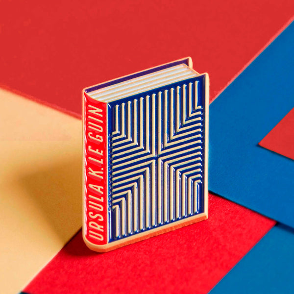 Ursula K. Le Guin enamel book pin for independent bookstores, illustration by Judy Kaufmann
